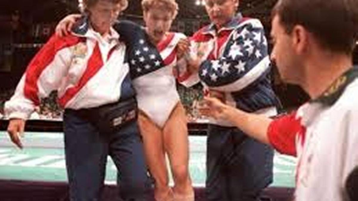 Gymnast Kerri Strug fights pain of sprained ankle at 1996 Olympics in Atlanta. Now convicted doctor, Larry Nassar, was on the sidelines.