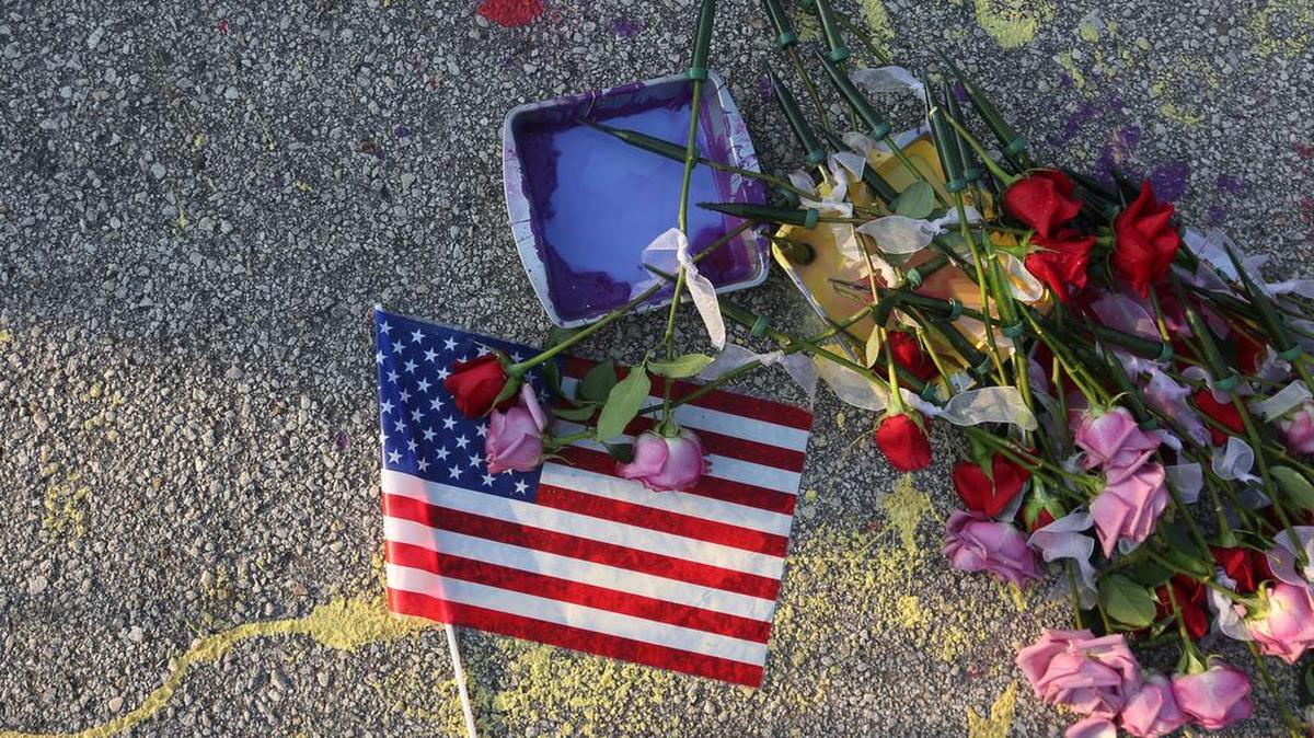A make-shift memorial for shooting victims rests on Orange Avenue in Orlando.