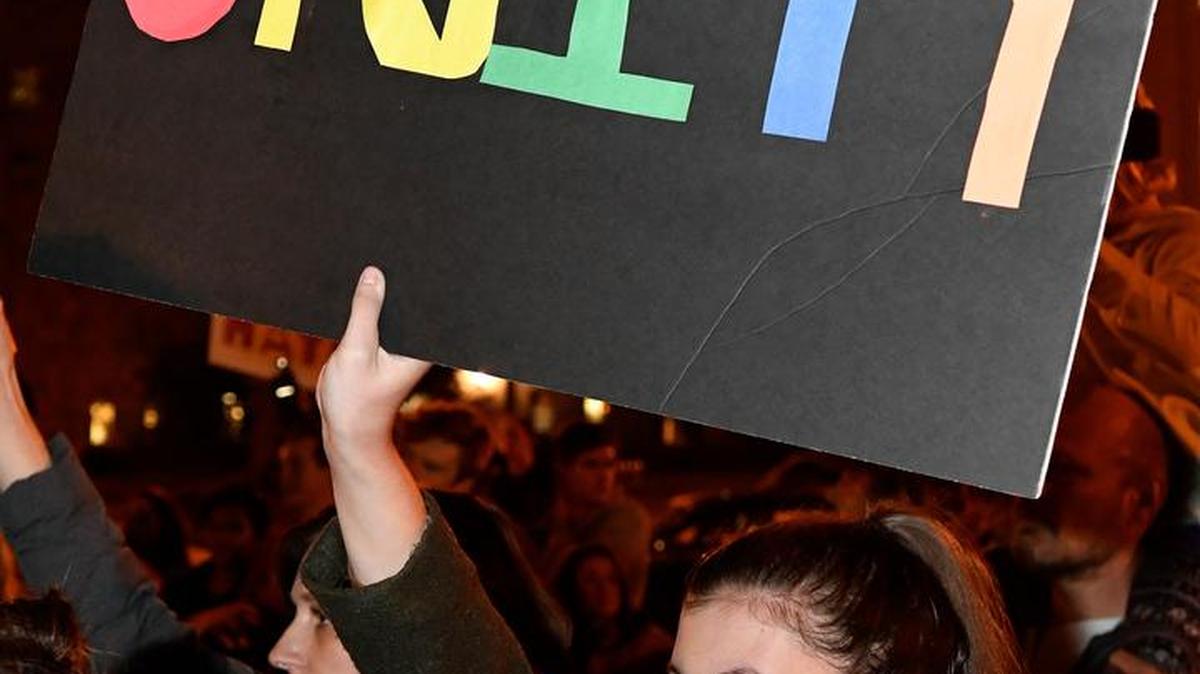 A protester in Louisville, Kentucky, opposed Donald Trump’s win. Many protests, some violent, occurred around the country.