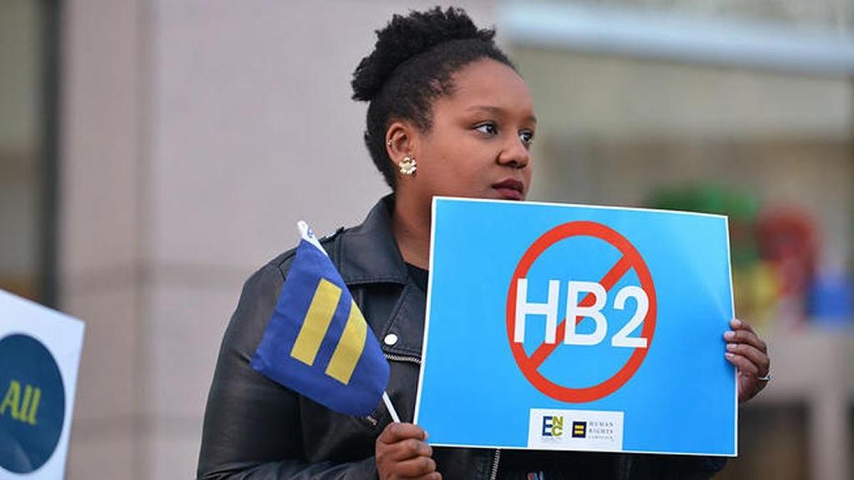 Woman protests North Carolina’s bathroom law, which discriminates against gays, lesbians and transgender people.