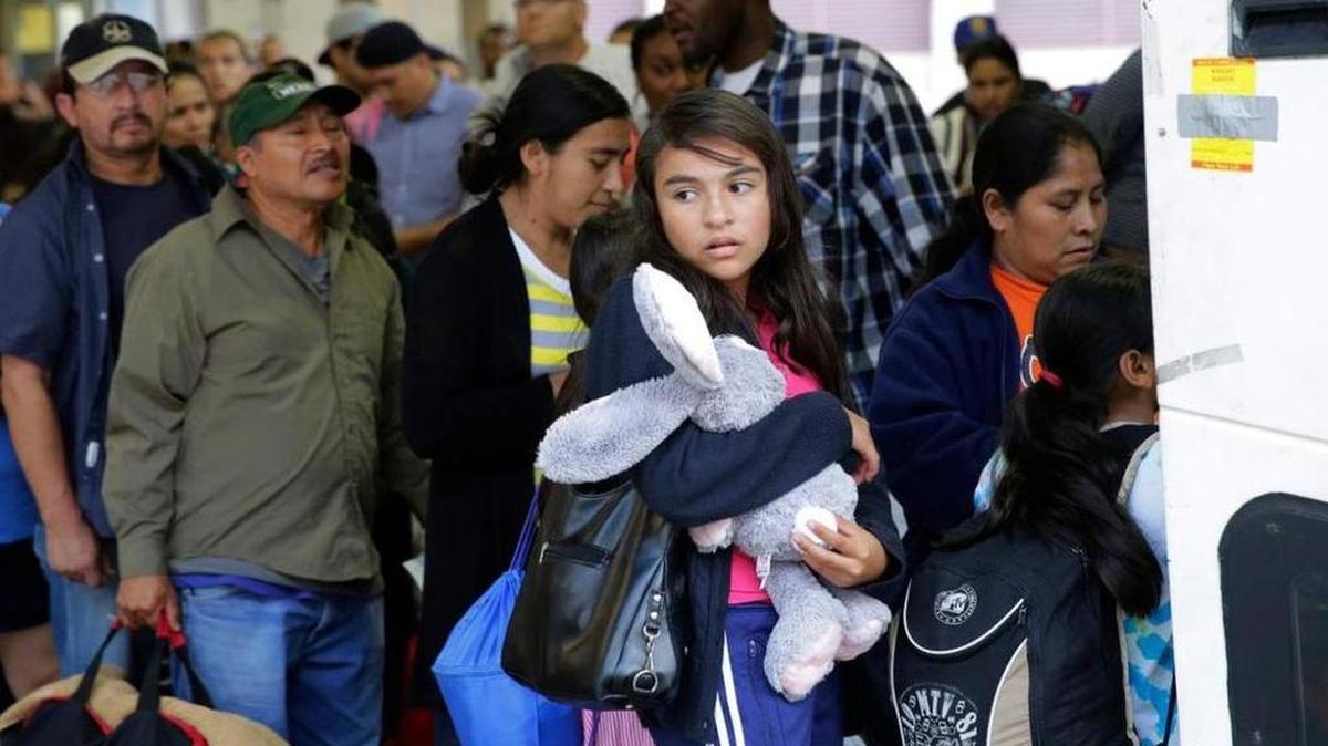 Central American migrants who entered the country illegally board a bus after they were released from a detention center in Texas.