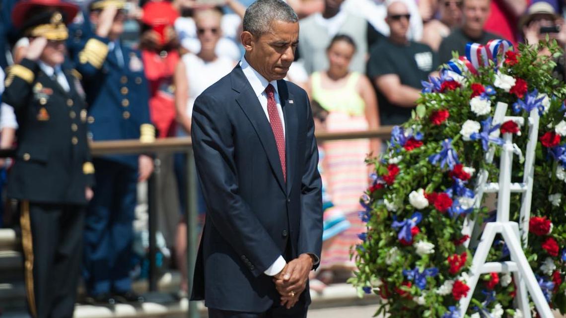 President Obama places a wreath at the Tomb of the Unknowns on Memorial Day 2015 at Arlington National Cemetery in Virginia.