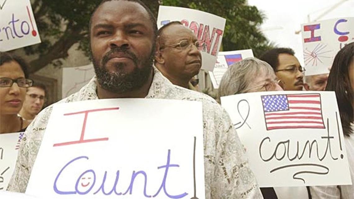 Men and women protest the state’s clemency process, which a judge ruled “fatally flawed.”
