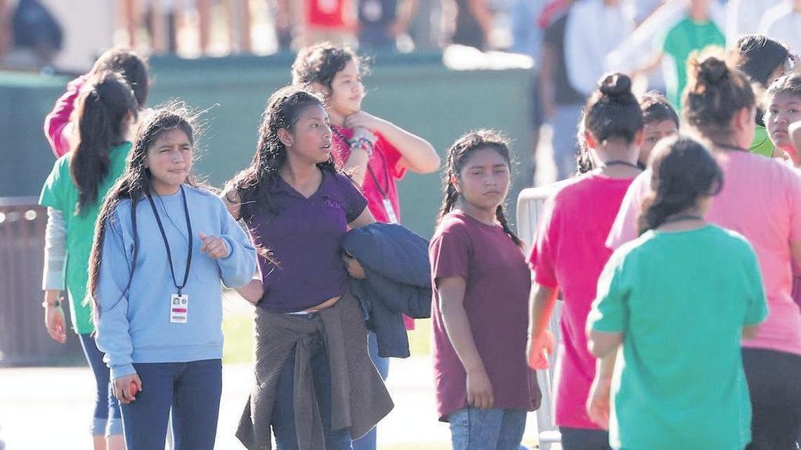 In February, girls rest after playing soccer at the Homestead Temporary Shelter for Unaccompanied Children.