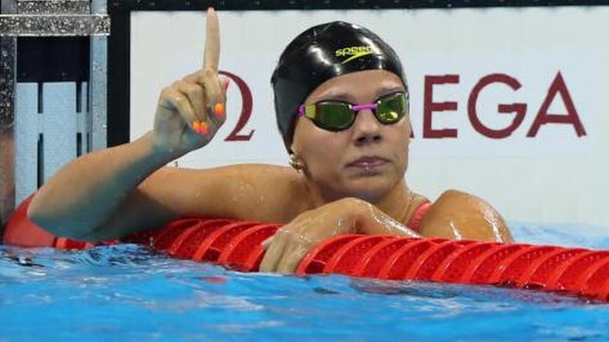 Russia’s Yulia Efimova flashes a #1 after winning a 100-meter breaststroke semifinal on Sunday. A U.S. swimmer took offense.