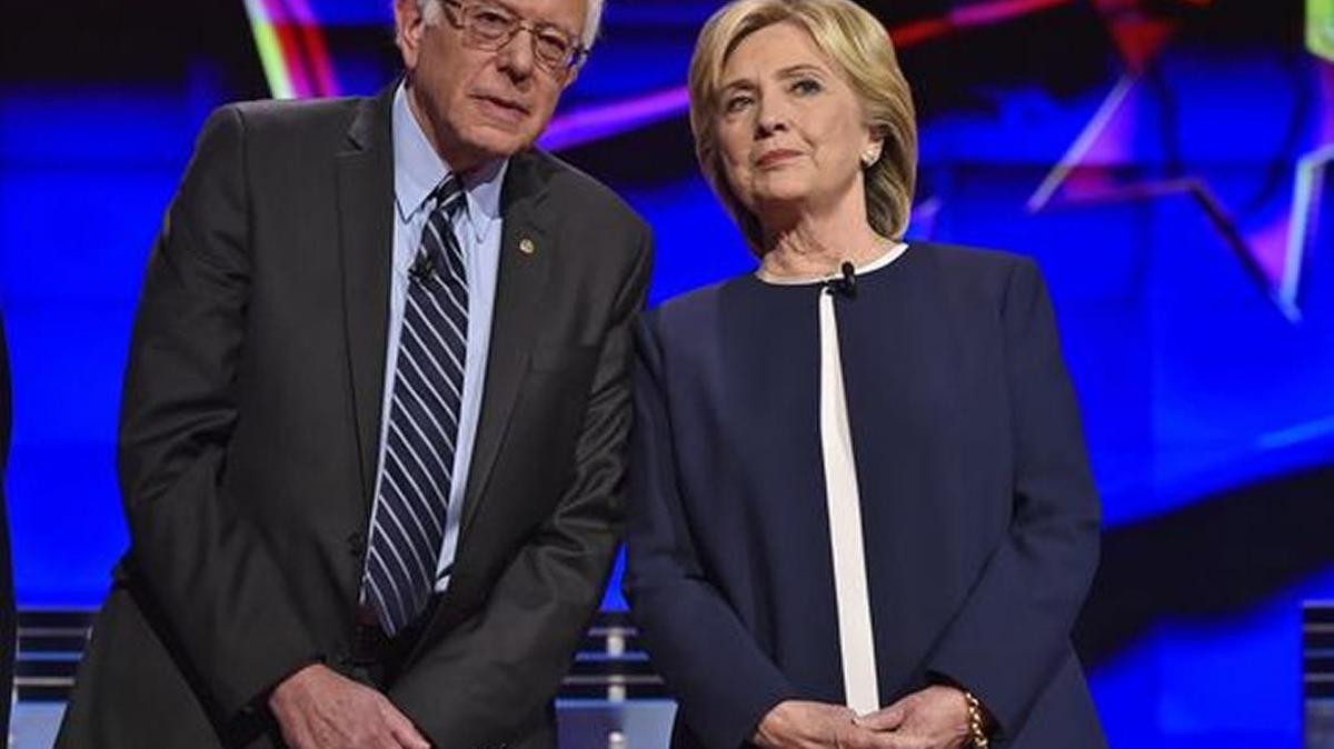
Bernie Sanders and Hillary Clinton talk before Tuesday’s Democratic presidential debate in Las Vegas.
