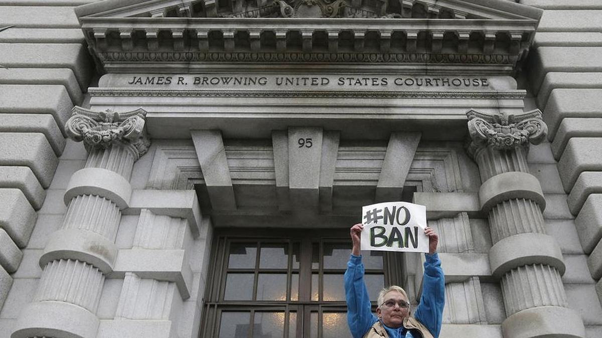 A protester makes a statement outside the Ninth U.S. Circuit Court of Appeals in San Francisco.