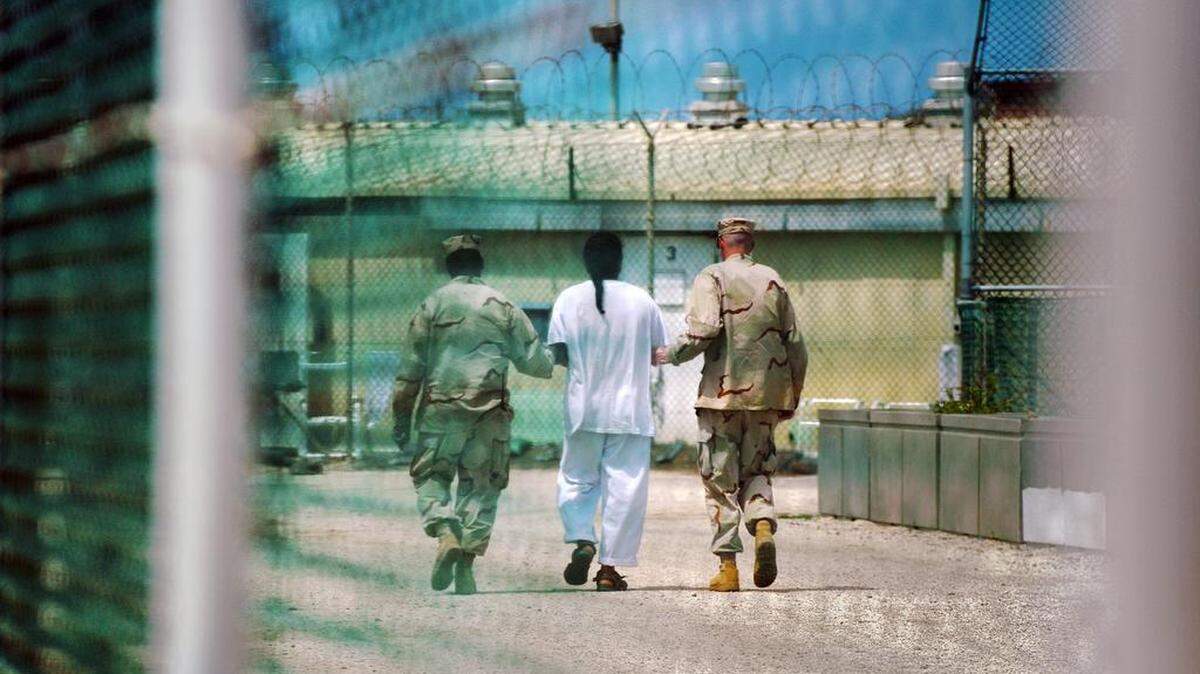In 2010, a detainee was escorted at Camp Delta detention facility in Guantánamo Bay.