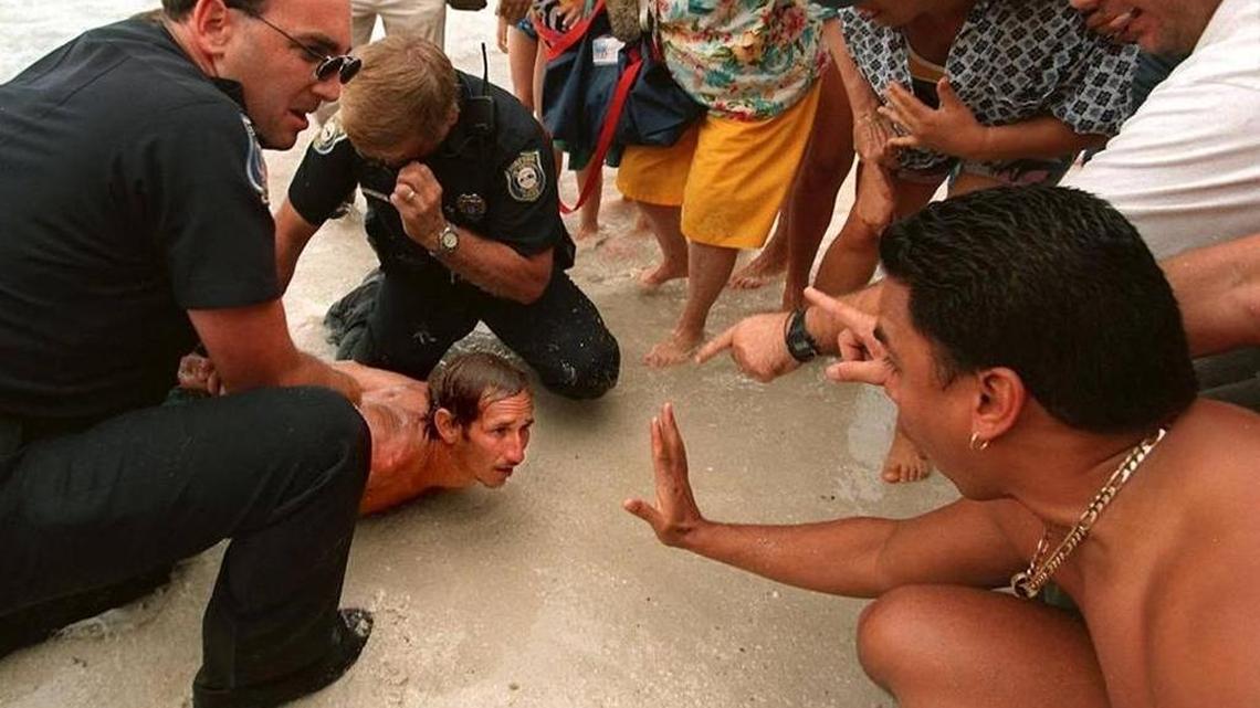 In 1999, a Cuban refugee swam hard to make it to shore in a crowded Surfside beach, well aware of the wet foot/dry foot policy.