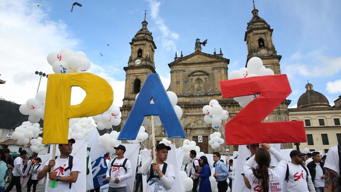 Supporters of the Colombian peace agreement hold up letters that form the word “Peace” in Spanish at a rally in Bogota.