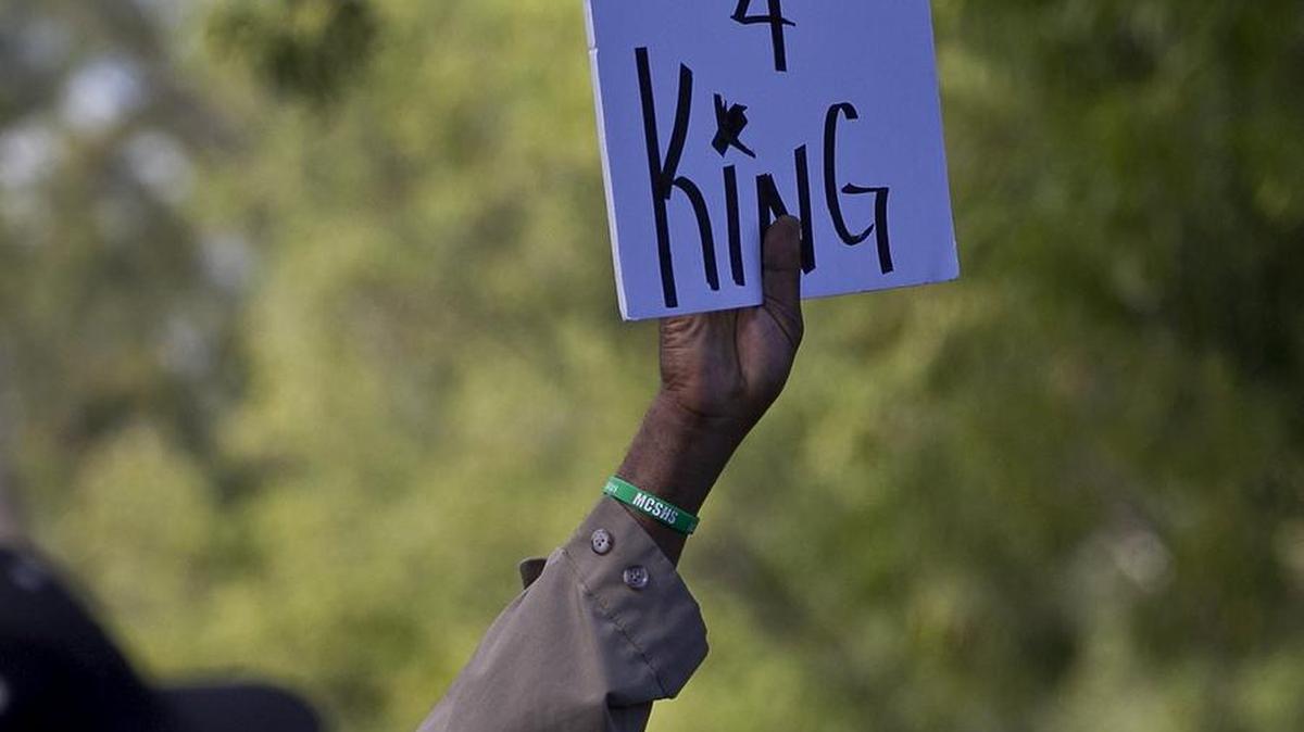 Friends and neighbors march in memory of King Carter, shot and killed at age 6.