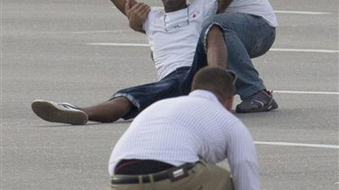 
A man is grabbed by a Cuban security officer as another one collects leaflets they threw as Pope Francis was arriving for a Mass at Revolution Plaza in Havana.
