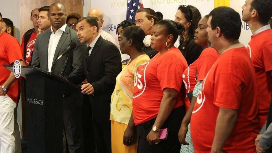 Miami Beach workers gather for a news conference last week to announce the mayor’s plan to set a citywide minimum wage.