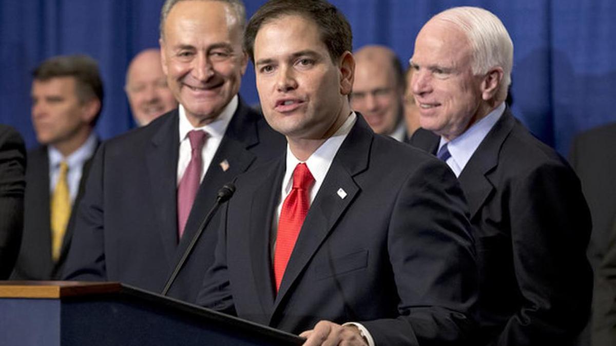 In 2013, Sen. Marco Rubio, along Senate colleagues Charles Schumer, D., N.Y., left, and Sen. John McCain, R., Arizona, speaks about immigration reform legislation by the Senate’s bipartisan “Gang of Eight.”