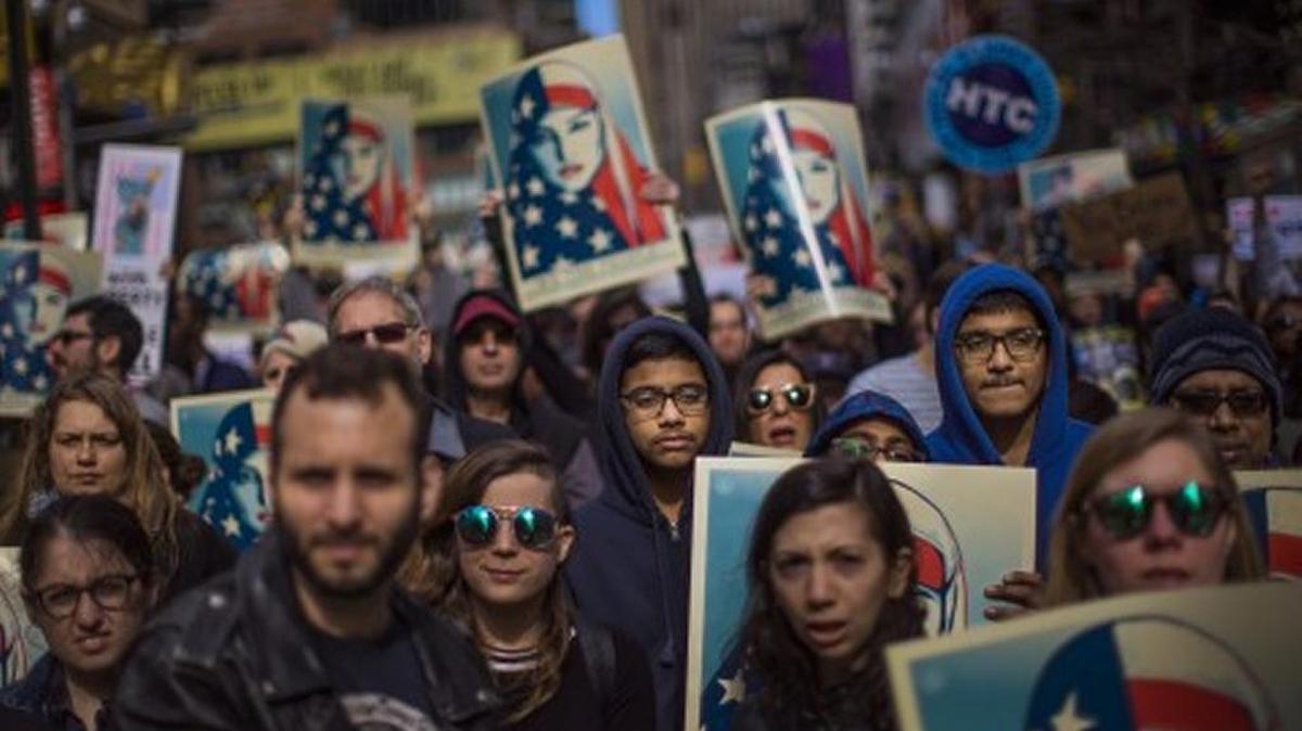 In February, protesters against President Trump’s original travel ban gathers in Times Square in New York.