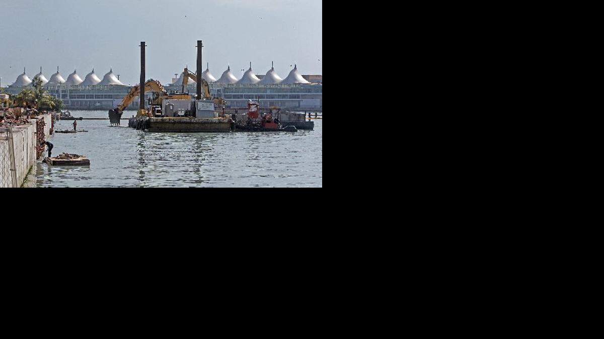 
WATSON ISLAND: Dredging equipment at the long-delayed megamarina and hotel project.
