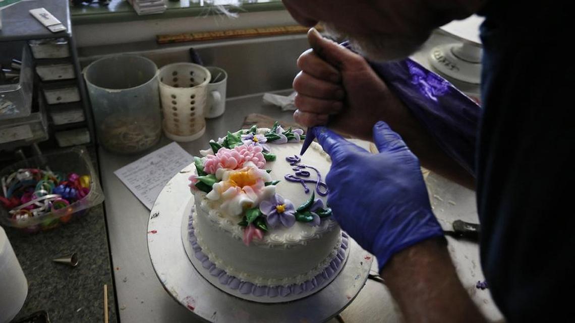 Jack Phillips decorates a cake at his Colorado bakery, Masterpiece Cakeshop.