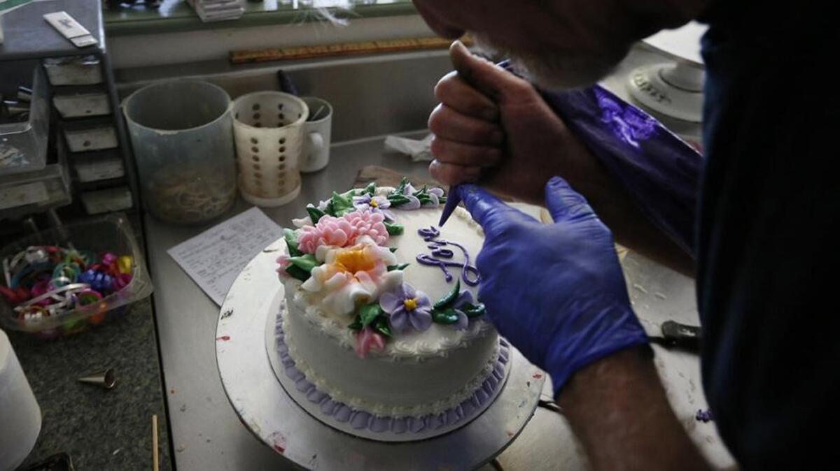 Jack Phillips decorates a cake at his Colorado bakery, Masterpiece Cakeshop.