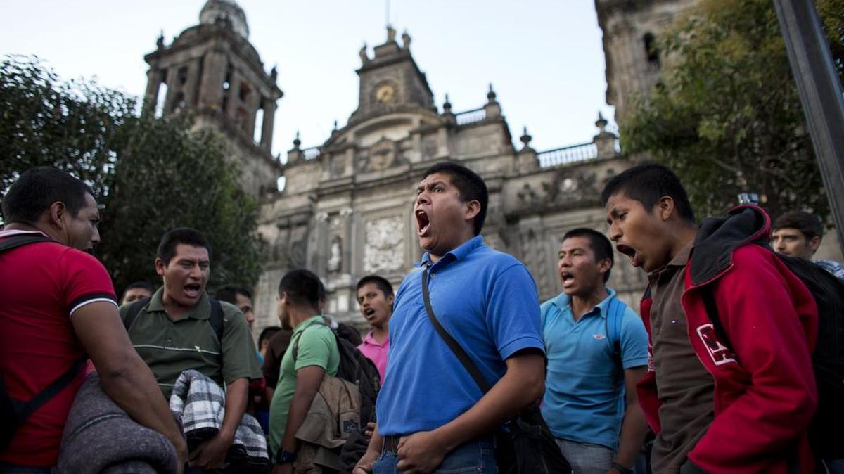Protestors in Mexico City’s main square demand a government probe of the disappearance of 43 students feared killed in 2014.