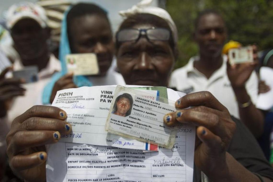 SEEKING RELIEF: Haitian sugar cane workers rally in front of the Haitian embassy in Santo Domingo demanding the Haitian passports needed to regularize their migration status in the Dominican Republic.