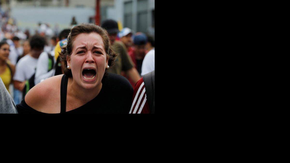 
A protesting student at Central University in Venezuela shouts out slogans denouncing President Maduro.
