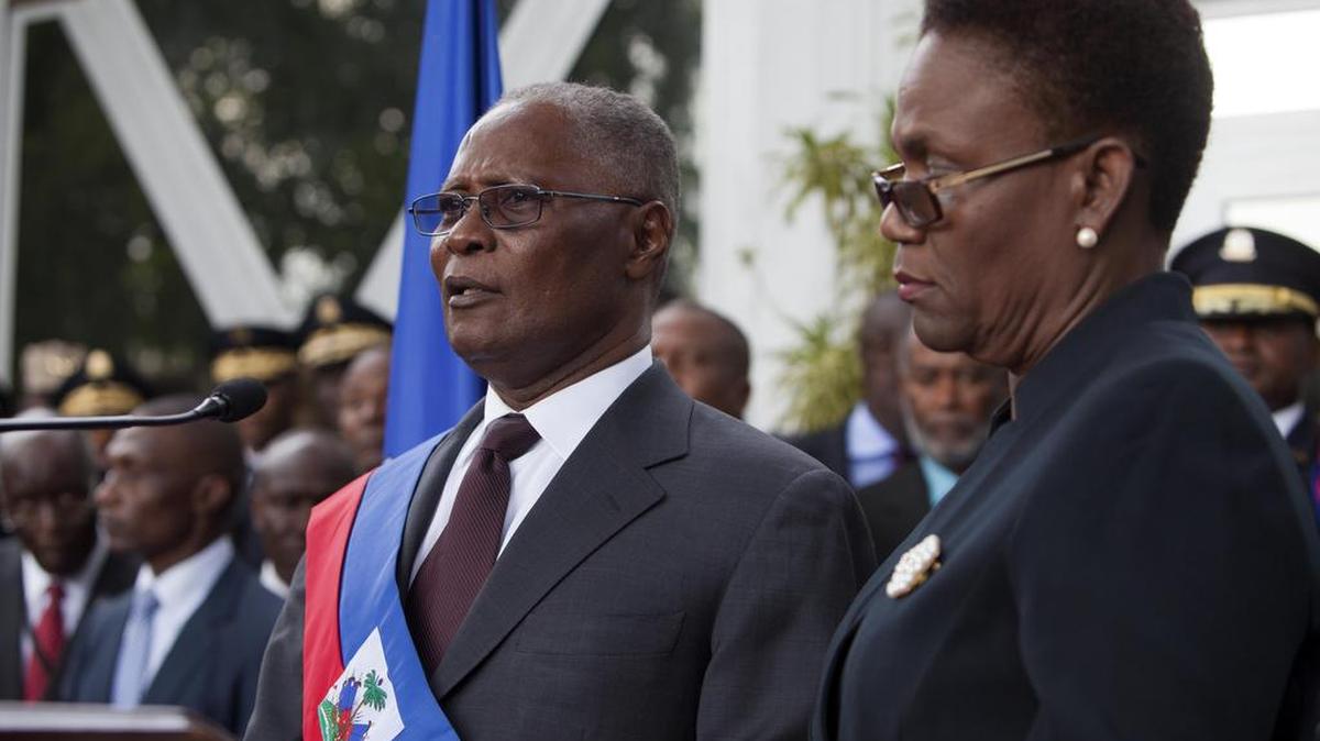 Provisional President Jocelerme Privert of Haiti spoke after his installation ceremony on Feb. 14 with his wife by his side.