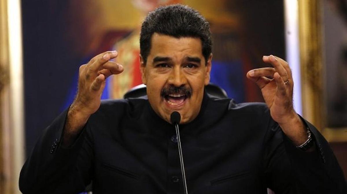 Venezuelan President Nicolas Maduro gestures at a news conference.