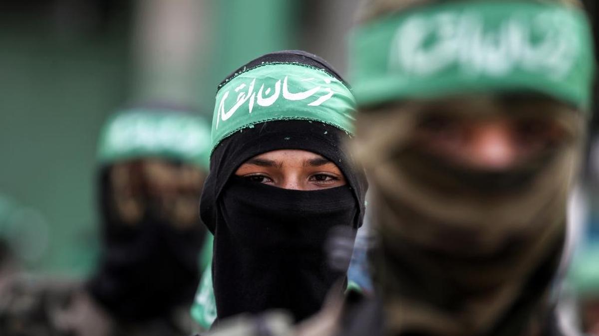 Masked youth cadets from an armed wing of the Palestinian Islamist Hamas movement, march in the southern Gaza Strip in 2017.