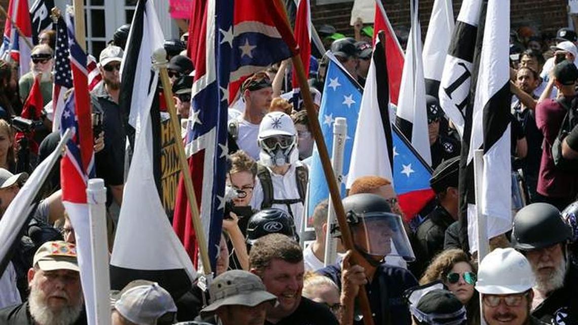 White supremacist demonstrators enter Emancipation Park surrounded by counter demonstrators in Charlottesville, Virginia, on Saturday.