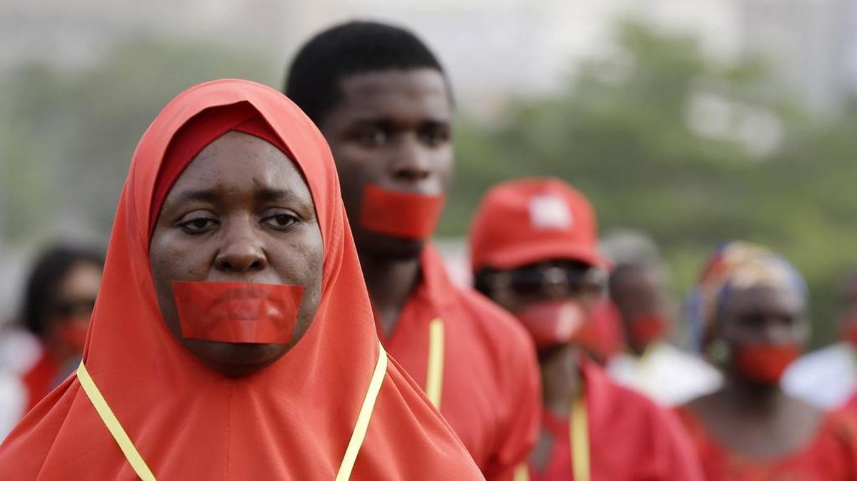 Nigerians marched in their nation’s capital, Abuja, during a silent protest to raise awareness about girls and boys abducted by Boko Haram.