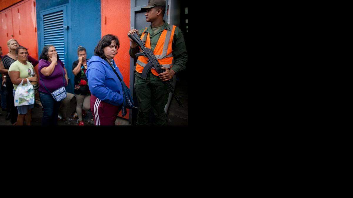 
SHORTAGES: People line up outside the Dia a Dia supermarket in Caracas one day after the government took over the chain of stores to punish businesses it blames for worsening shortages.
