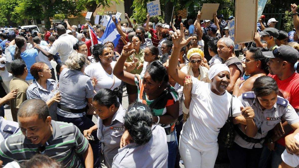 Cuban police detain members of Ladies in White, a dissident group of wives and mothers of political prisoners calling for their release.