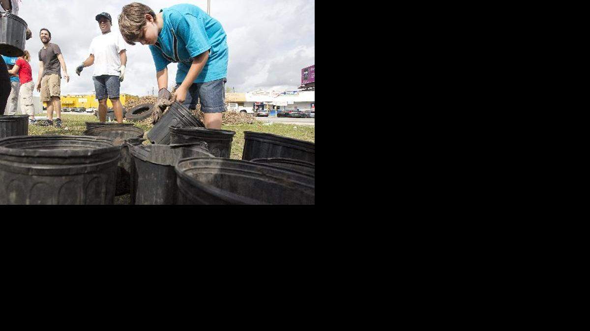 
DIGGING DEEP: Michael Zavala takes part in a Breakthrough Miami gardening project.
