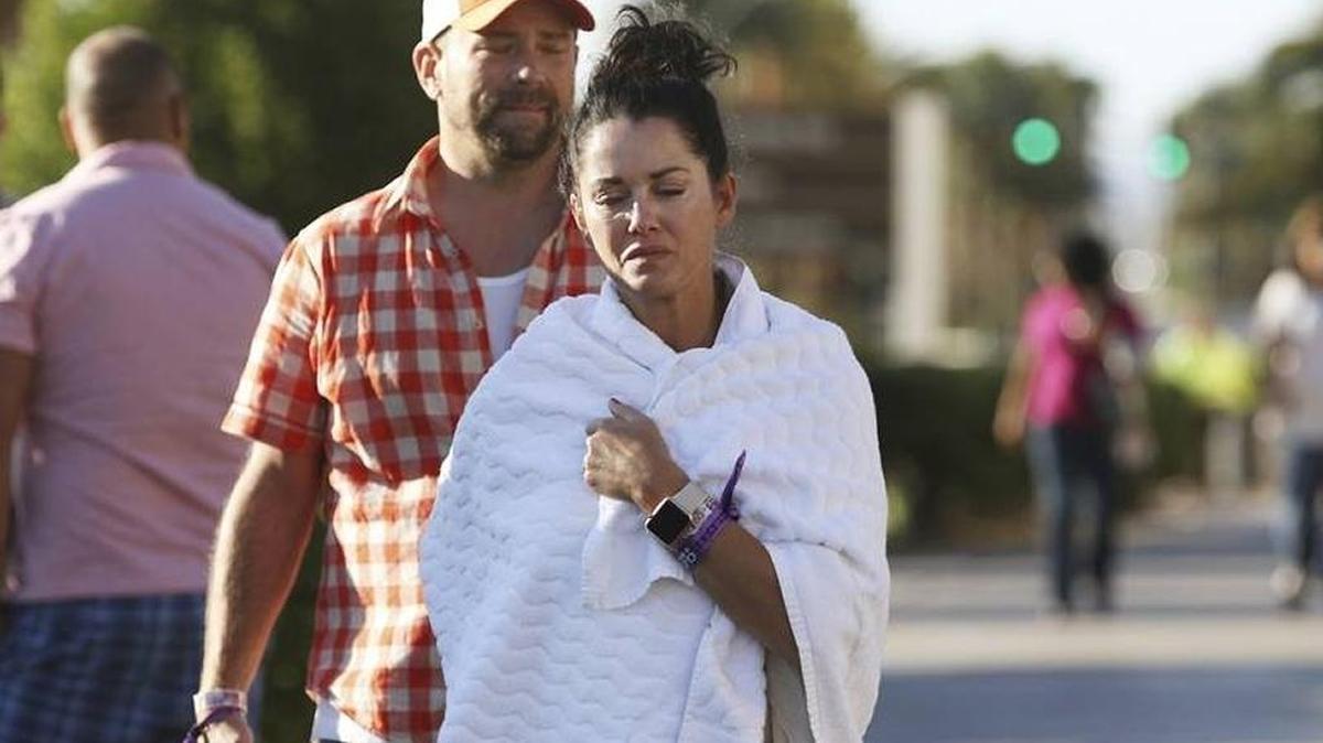 Concert-goers who survived Sunday’s slaughter walk in a daze on the The Strip on Monday.