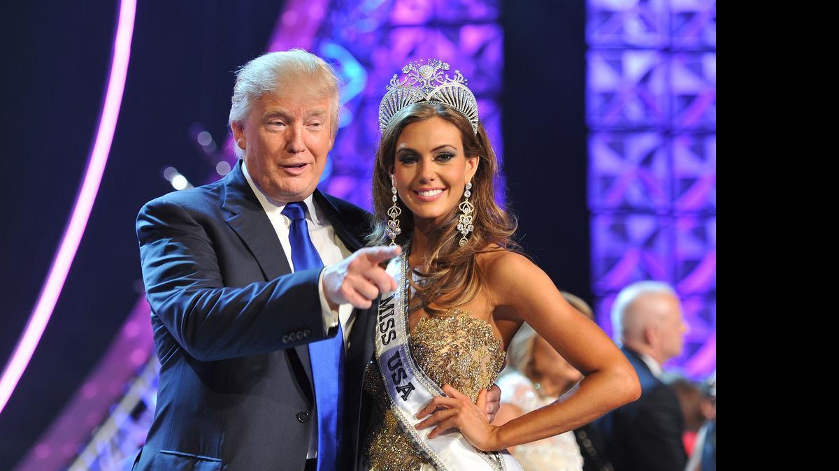 
FIRED? Donald Trump and the winner of the 2013 Miss USA contest, Erin Brady. Univision says it is dropping the pageant and will cut all business ties with Trump. 
