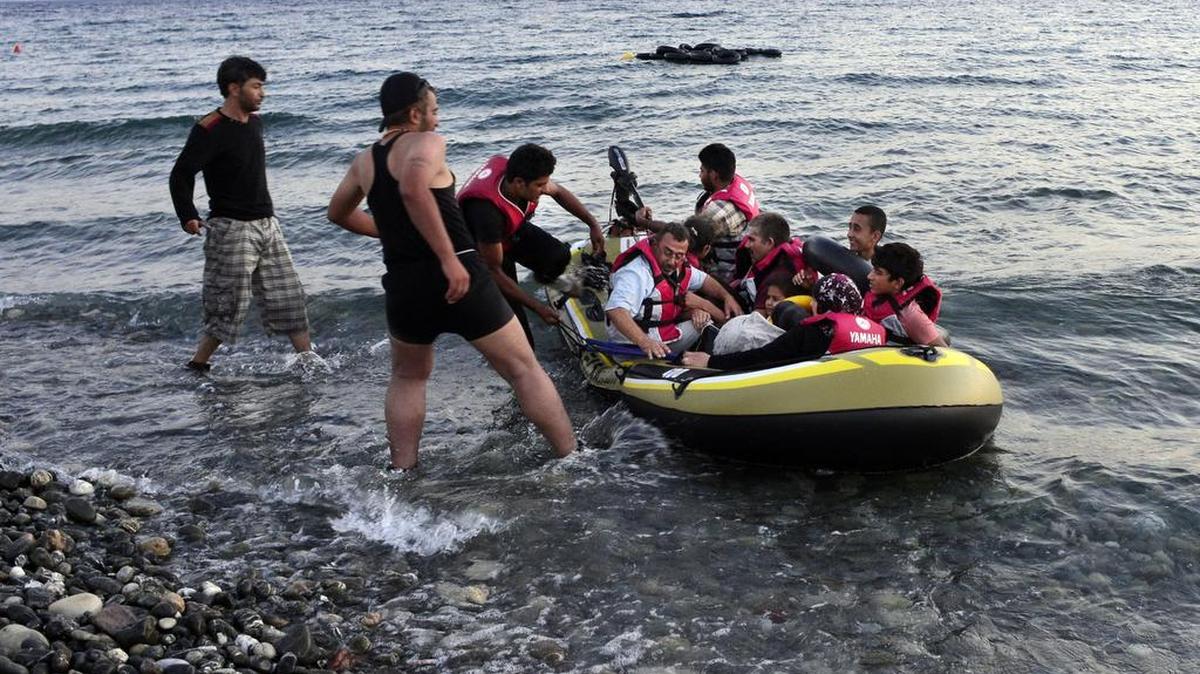 
MIGRANT CRISIS: A small dinghy packed with Syrian migrants approaches a beach on the Greek island of Kos after crossing a part of the Aegean Sea from Turkey to Greece.
