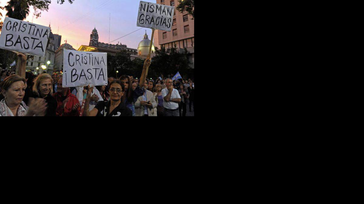 
BUENOS AIRES: People hold signs reading “Enough, Cristina” and “Thank you, Nisman” in a protest against the death of public prosecutor Alberto Nisman. He was found dead just days after accusing President Cristina Kirchner of obstructing a probe into a 1994 Jewish center bombing. 
