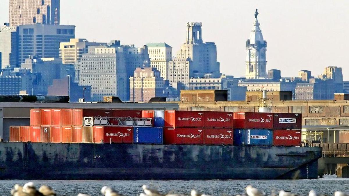 Shipping containers on a barge in the Delaware River off the city of Philadelphia.