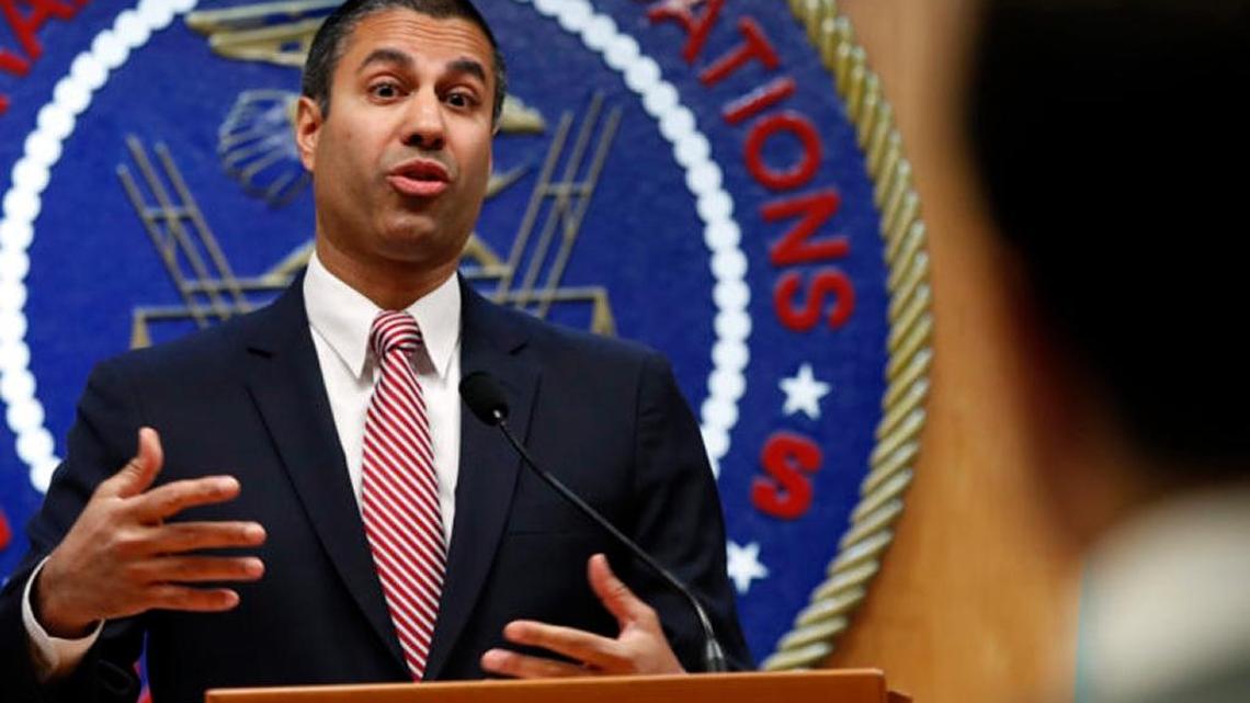 After the vote to end net neutrality, Federal Communications Commission Chairman Ajit Pai answers a question from a reporter in Washington.