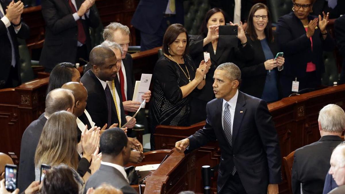 President Obama talks with lawmakers after speaking to the Illinois General Assembly last week.