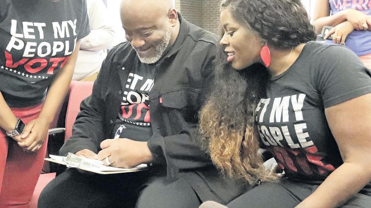 In January, Desmond Meade, ex-felon and president of the Florida Rights Restoration Coalition, filled out a voter registration form in Orlando.