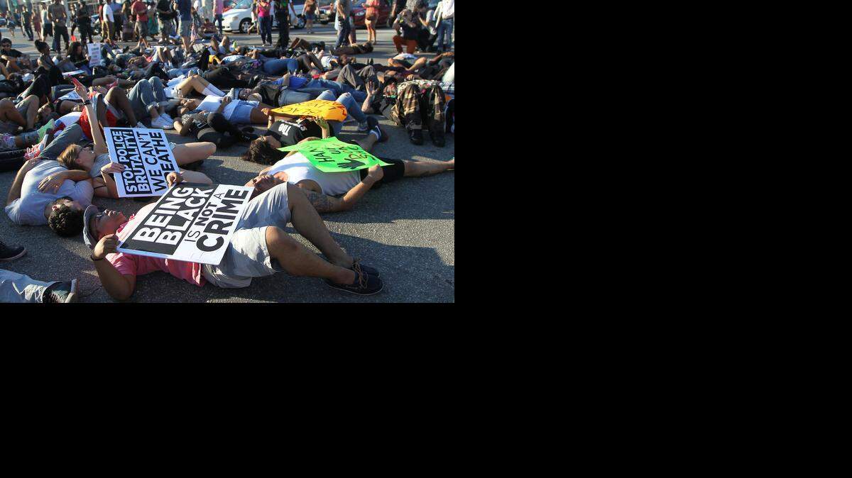 
MIAMI PROTEST: Protestors shut down traffic on N. Miami Avenue Sunday in protest of recent deaths of black men at the hands of police in other states.
