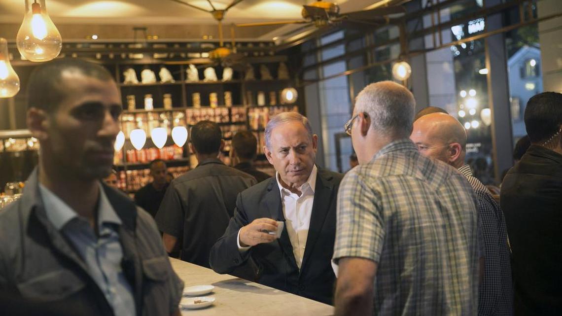 Prime Minister Netanyahu visits the scene of a shooting attack by Palestinian gunmen on Wednesday in Tel Aviv.