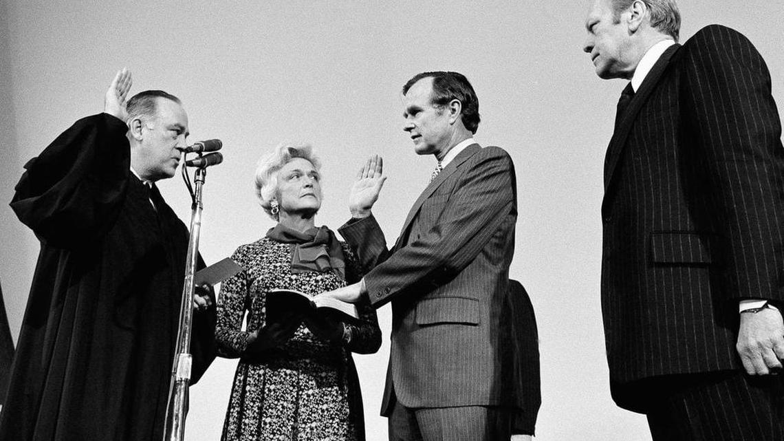 FILE - George H.W. Bush, center, is sworn in as director of the Central Intelligence Agency.