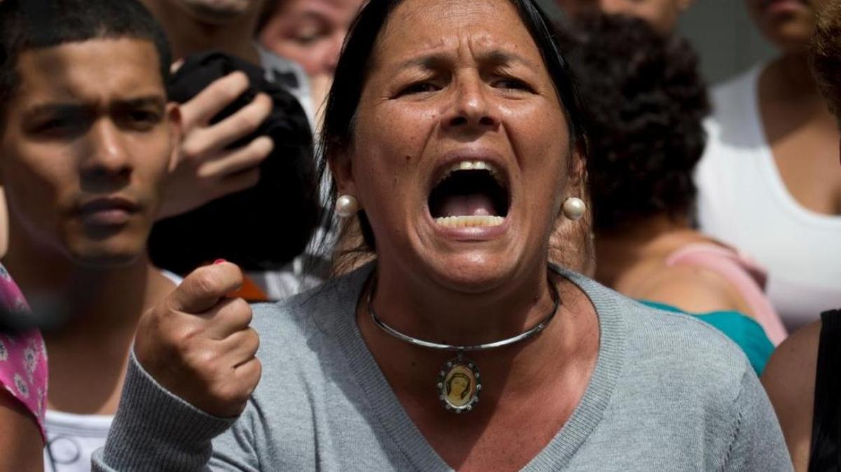 A woman shouts in the street during one of the many anti-Nicolas Maduro regime protests this year in Caracas.