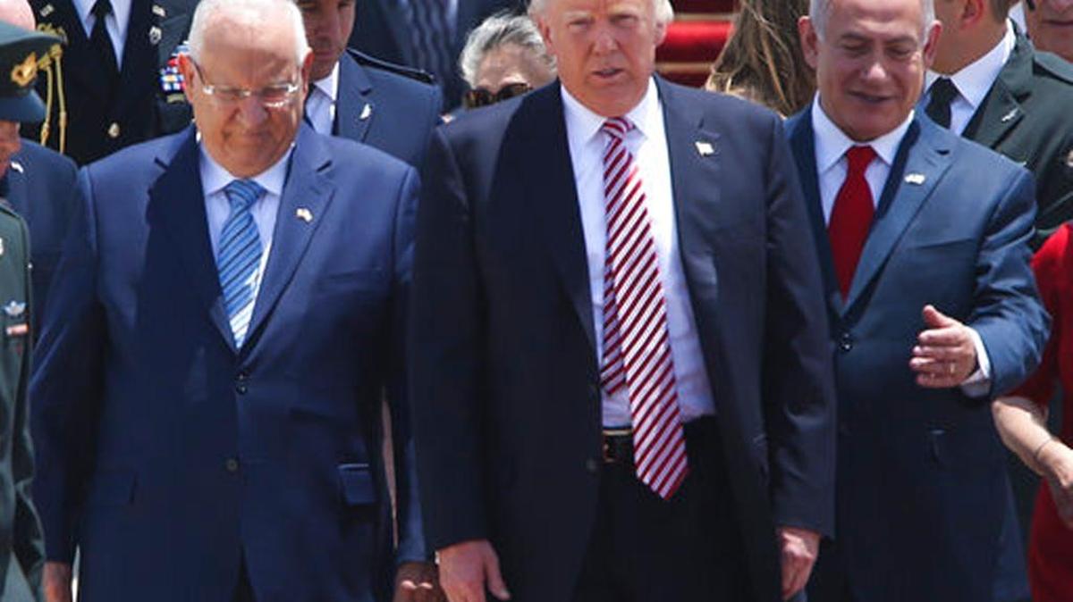 President Donald Trump accompanied by the Israeli President Rueben Rivlin, right, and Prime Minister Benjamin Netanyahu in Tel Aviv on Monday.
