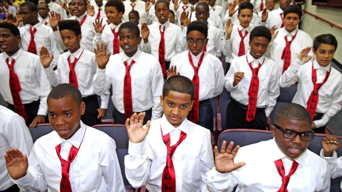 Students take the oath of the 5000 Role Models at Coral Reef High School last fall.