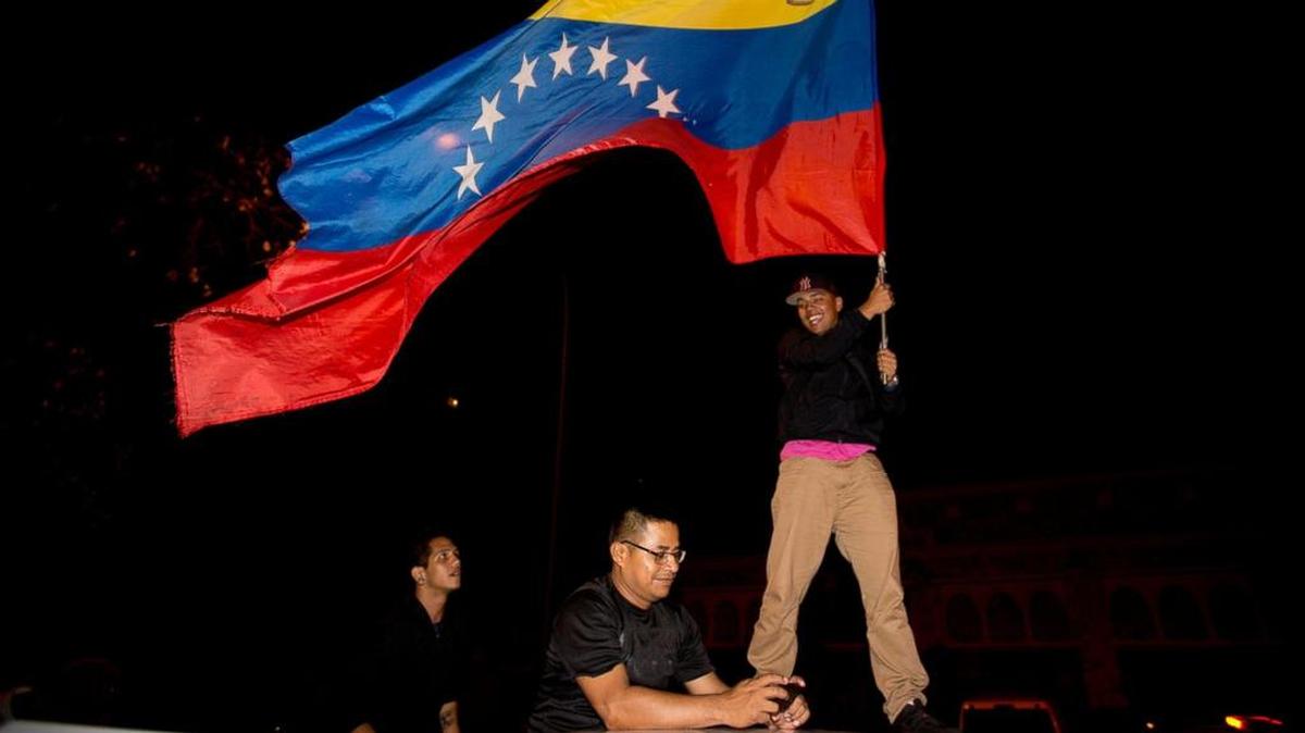 Opposition supporters celebrate the outcome of Venezuela’s Assembly elections.