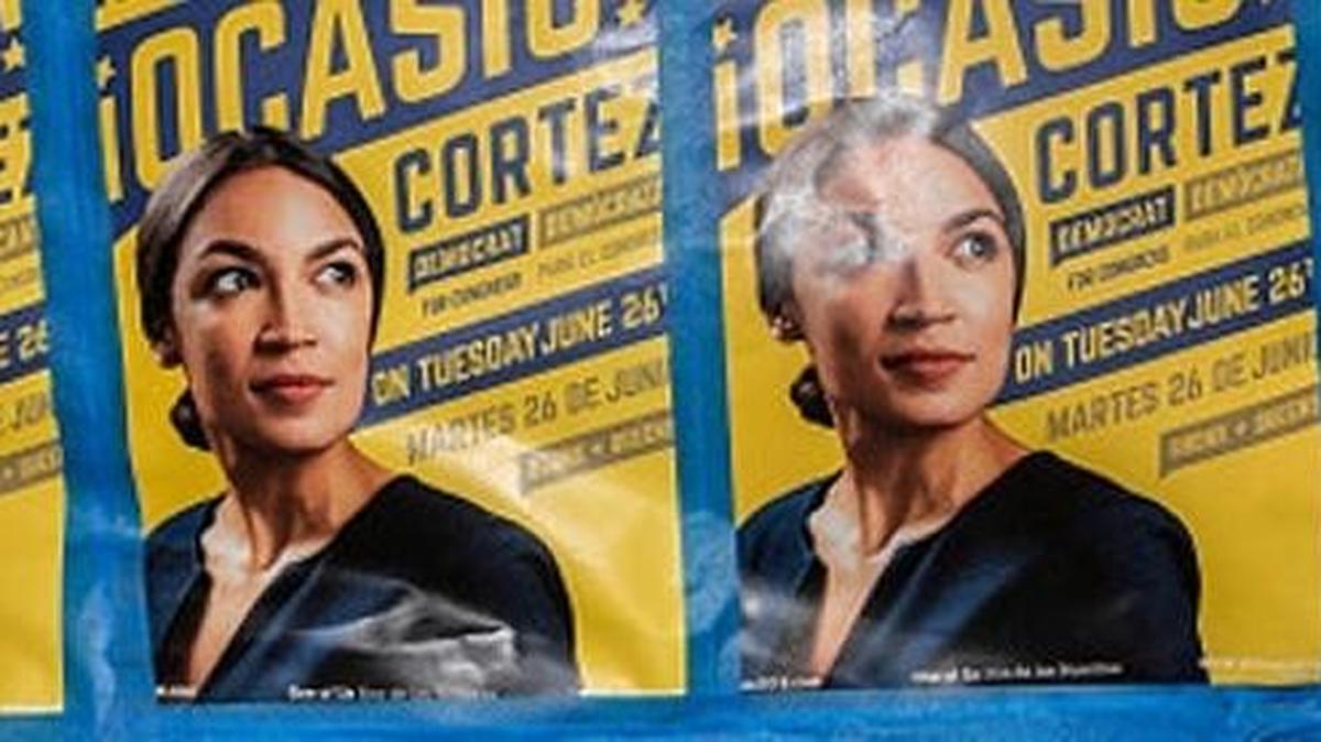 A row of campaign posters touts Alexandria Ocasio-Cortez, who beat a Democratic establishment incumbent in Congress in New York.