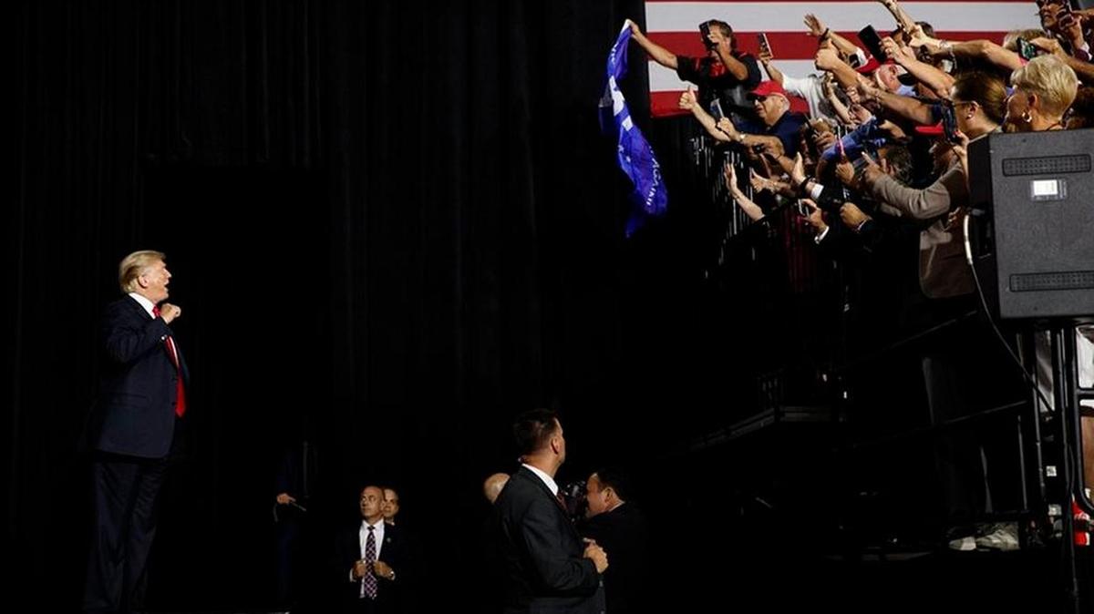 At President Trump’s Tampa rally on Tuesday some attendees waved QAnon signs at the Florida State Fair Grounds.